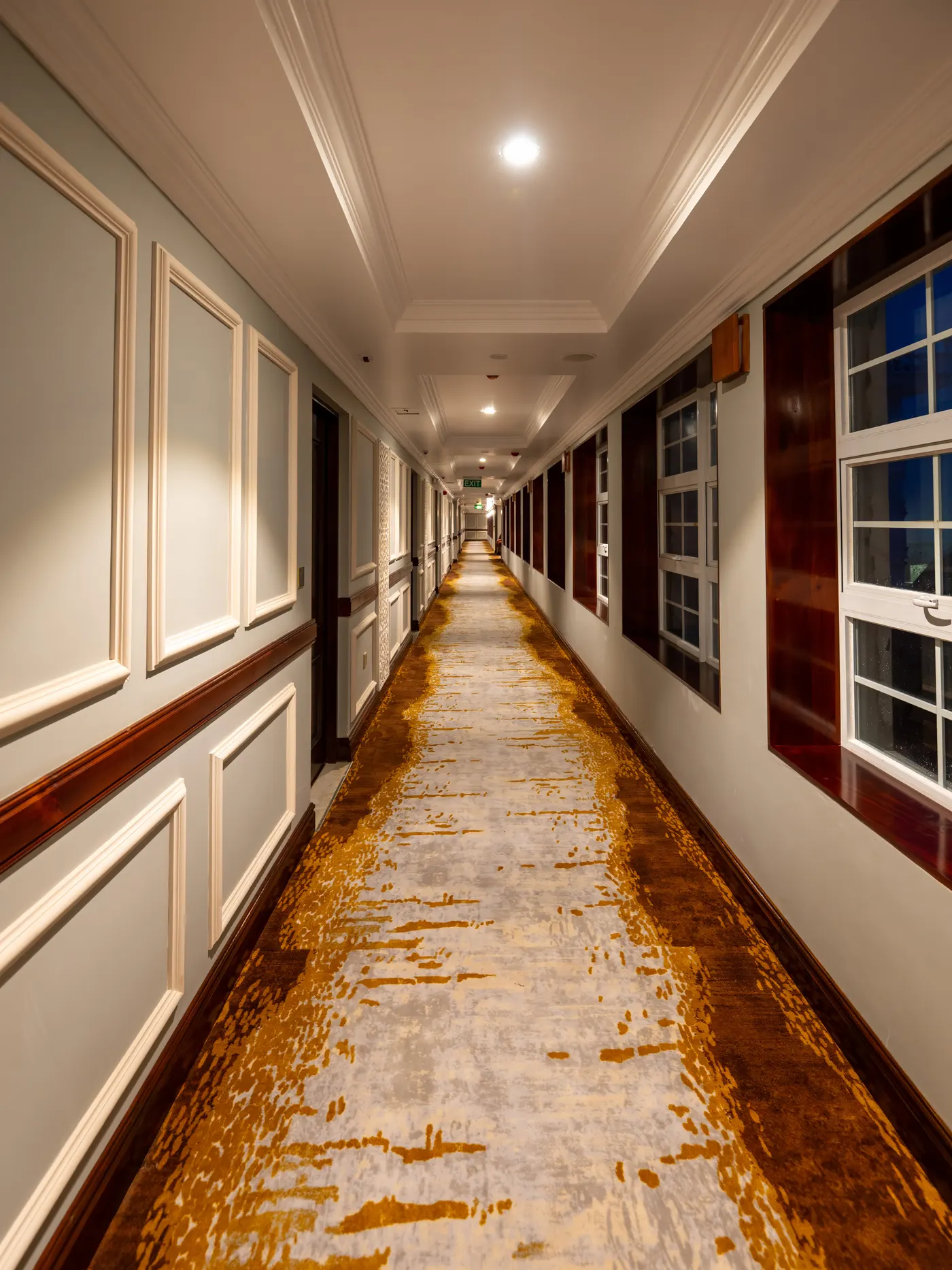 Guest corridor with a patterned gold runner