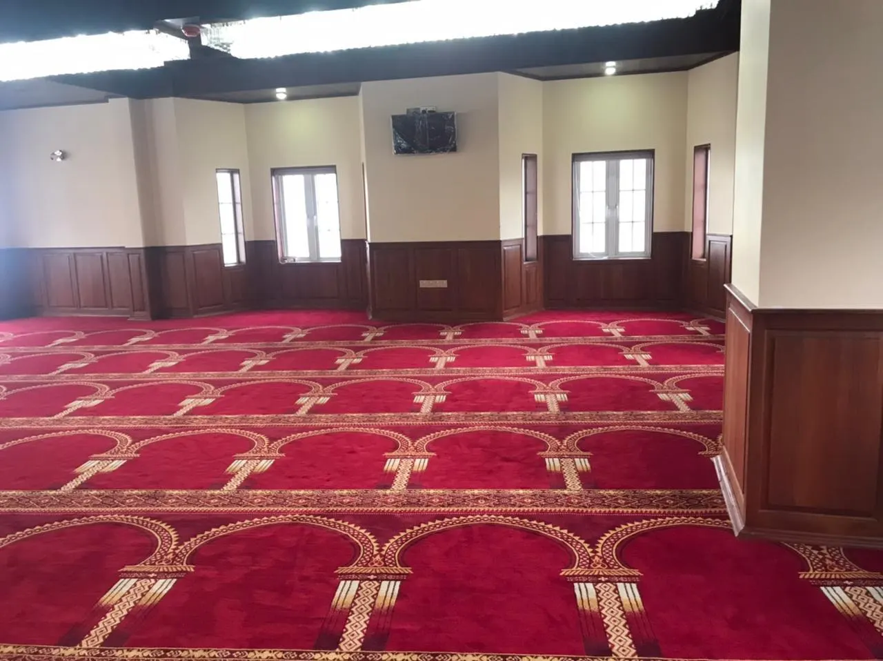The dedicated prayer room with traditional prayer carpet
