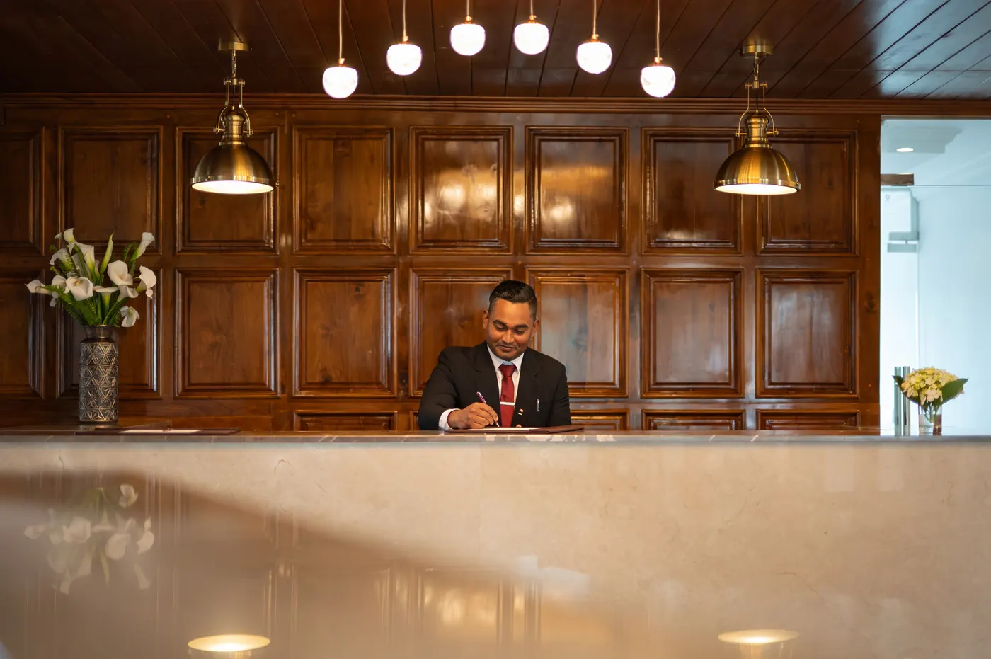 The Horton Heights reception desk in panelled mahogany